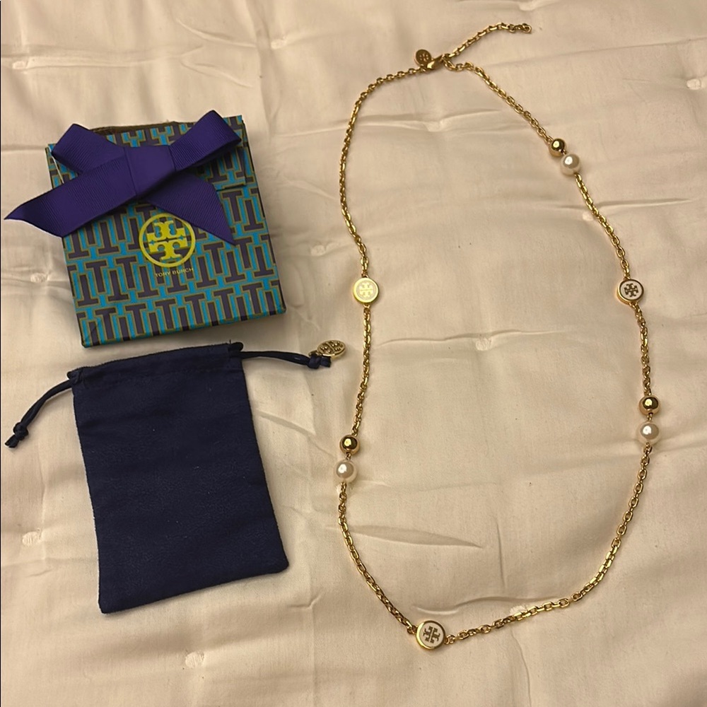 Tory Burch gold and pearl long necklace. 17 in or extended to 18in.